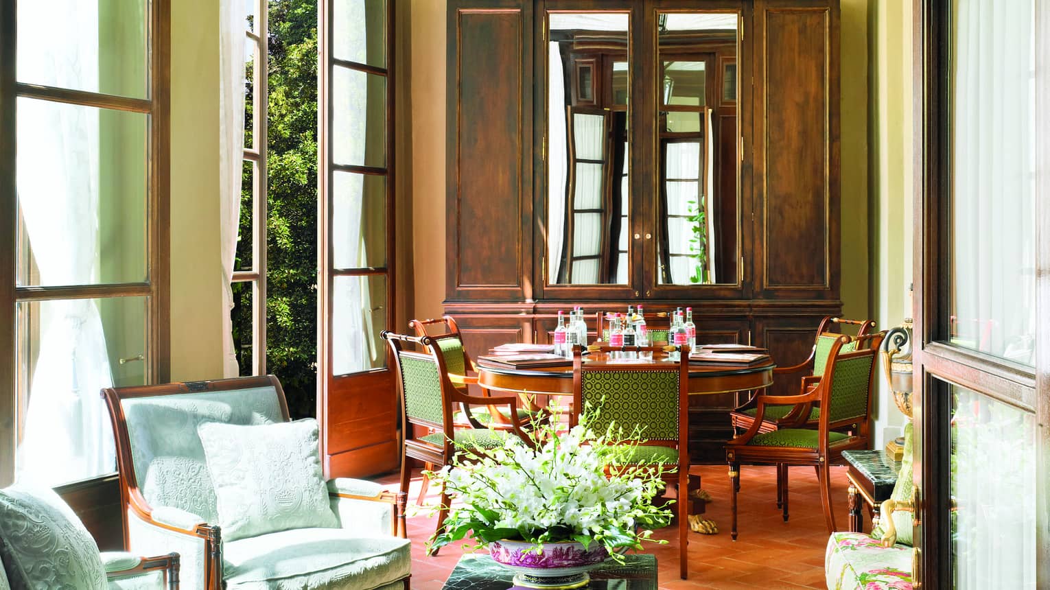 Pinti Room, lantern hangs from arched ceiling over sunny seating area