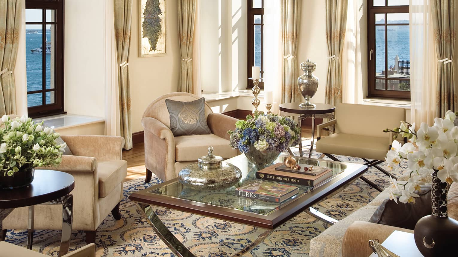 Elegant Ottoman-style seating lounge with chandelier, soaring ceilings