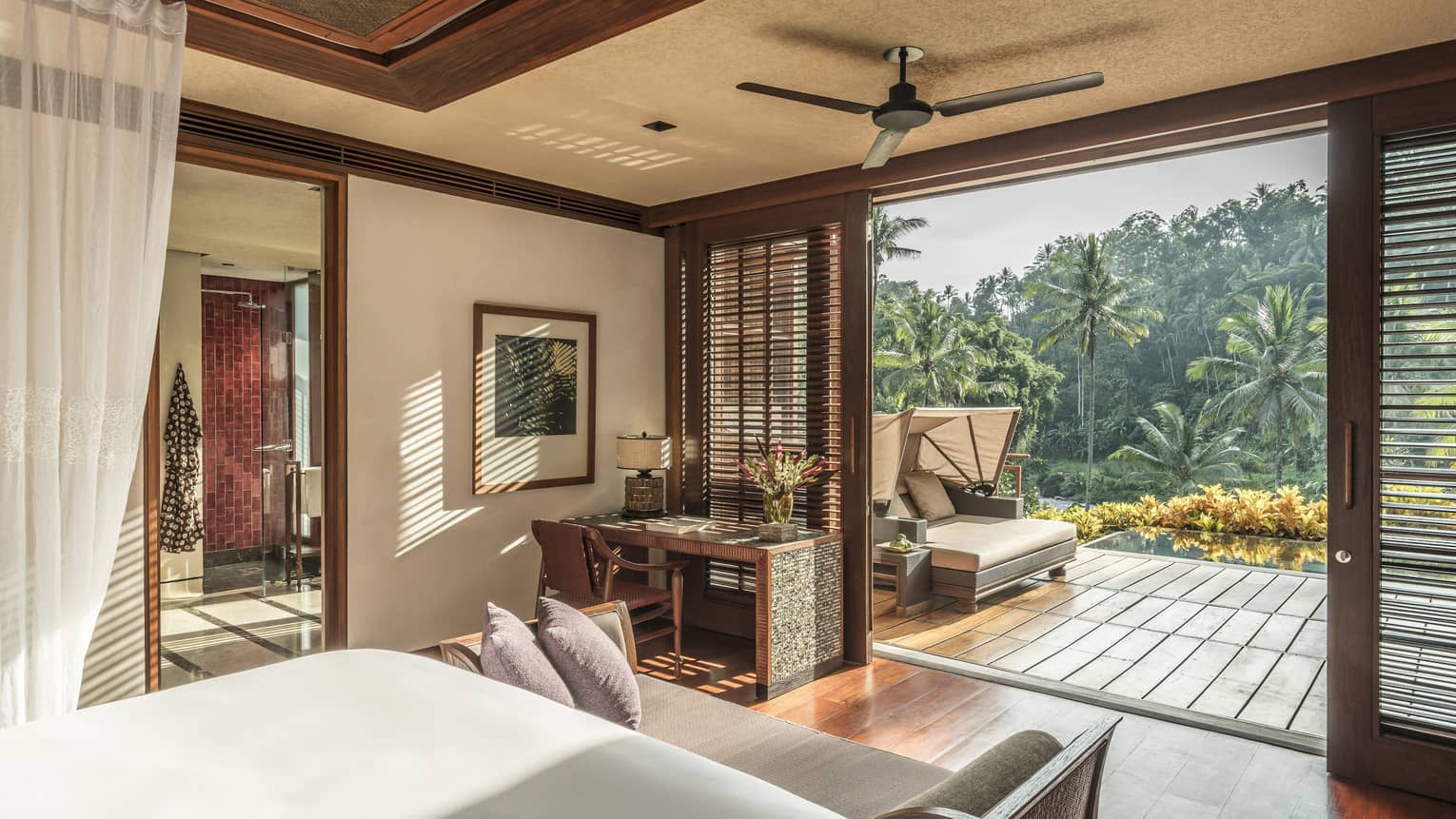 A scenic view from a spacious room overlooking a forest and river in Bali