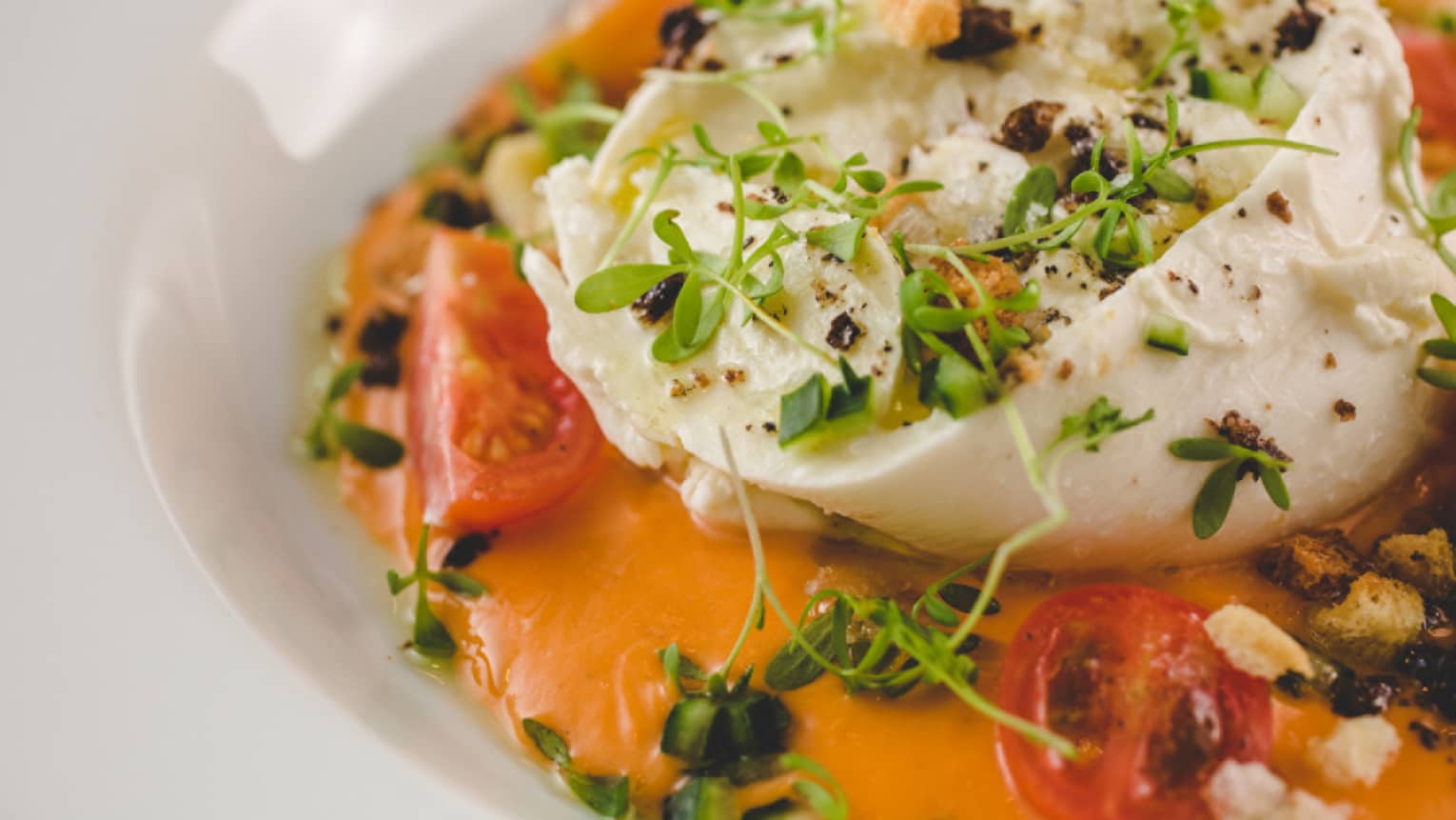 A cheesy dish with a tomato base sauce.