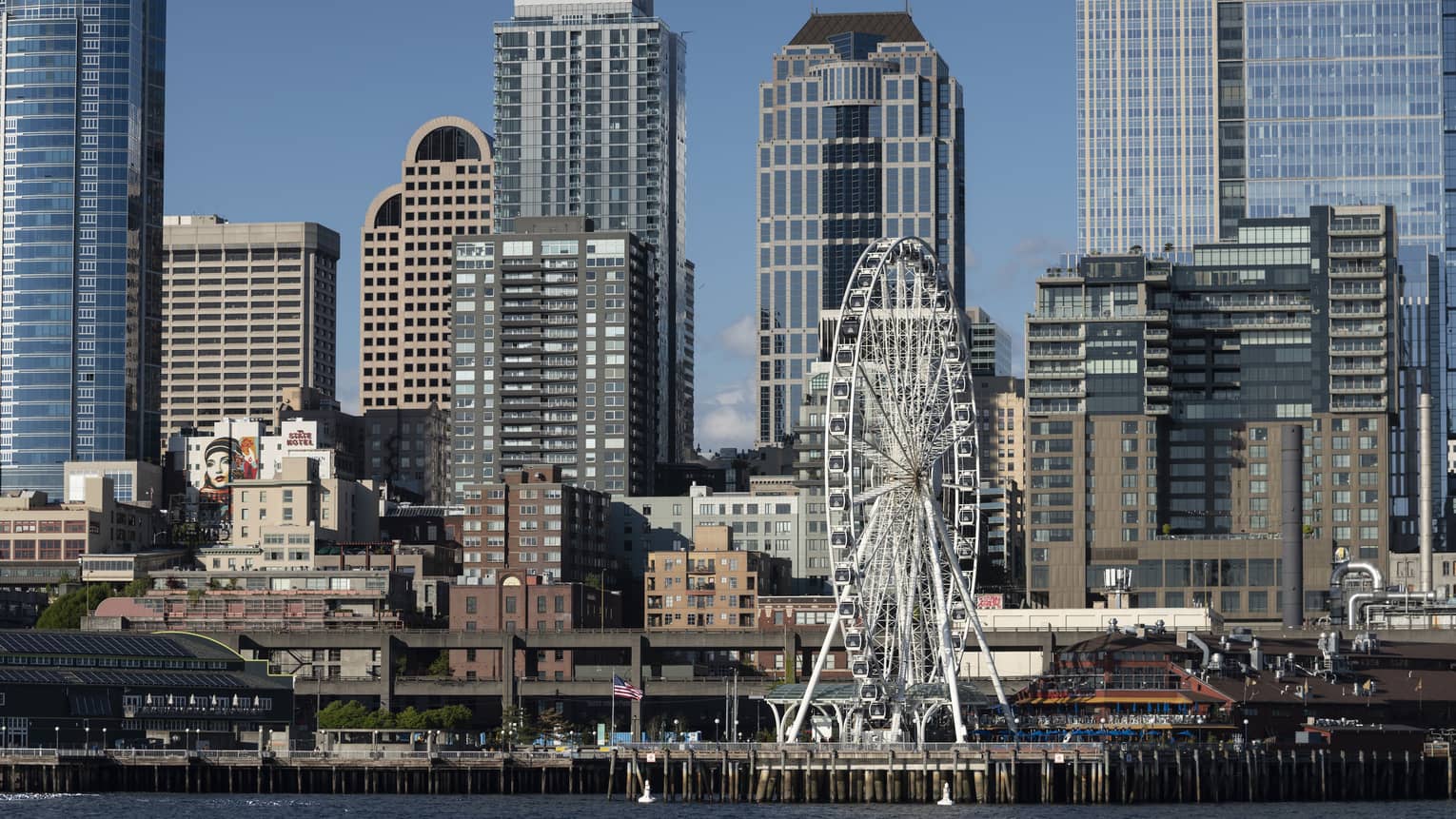 The Seattle Great Wheel stands out among skyscrapers on Elliott Bay
