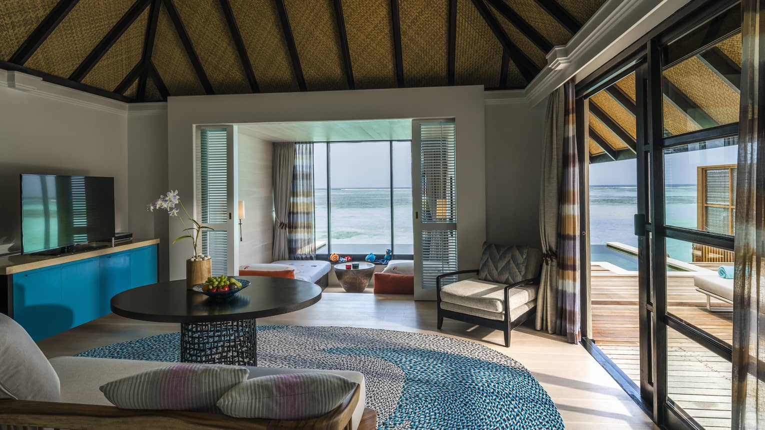 A family room and a kids' bedroom in a beautiful water villa 