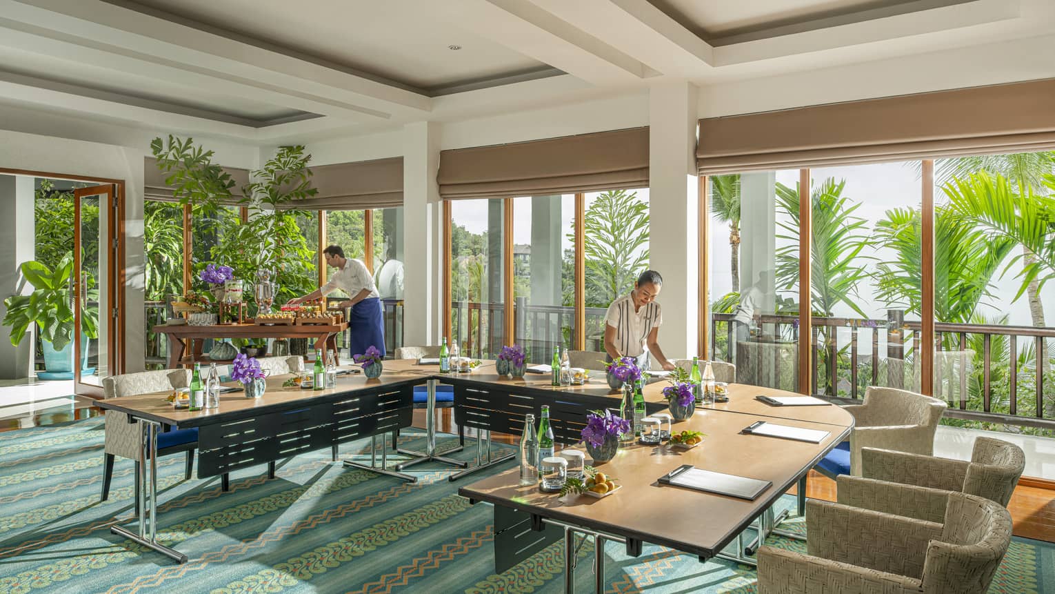 Chef and team member prepare Khob Fah meeting room for an event