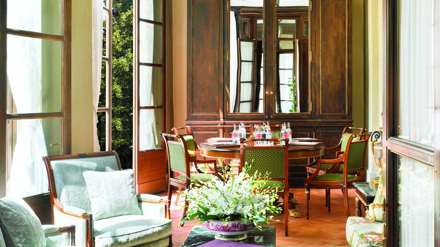 Pinti Room, lantern hangs from arched ceiling over sunny seating area