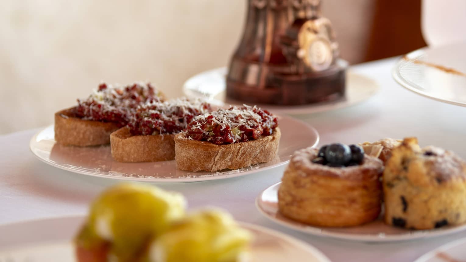 Plates of pastries on dining table