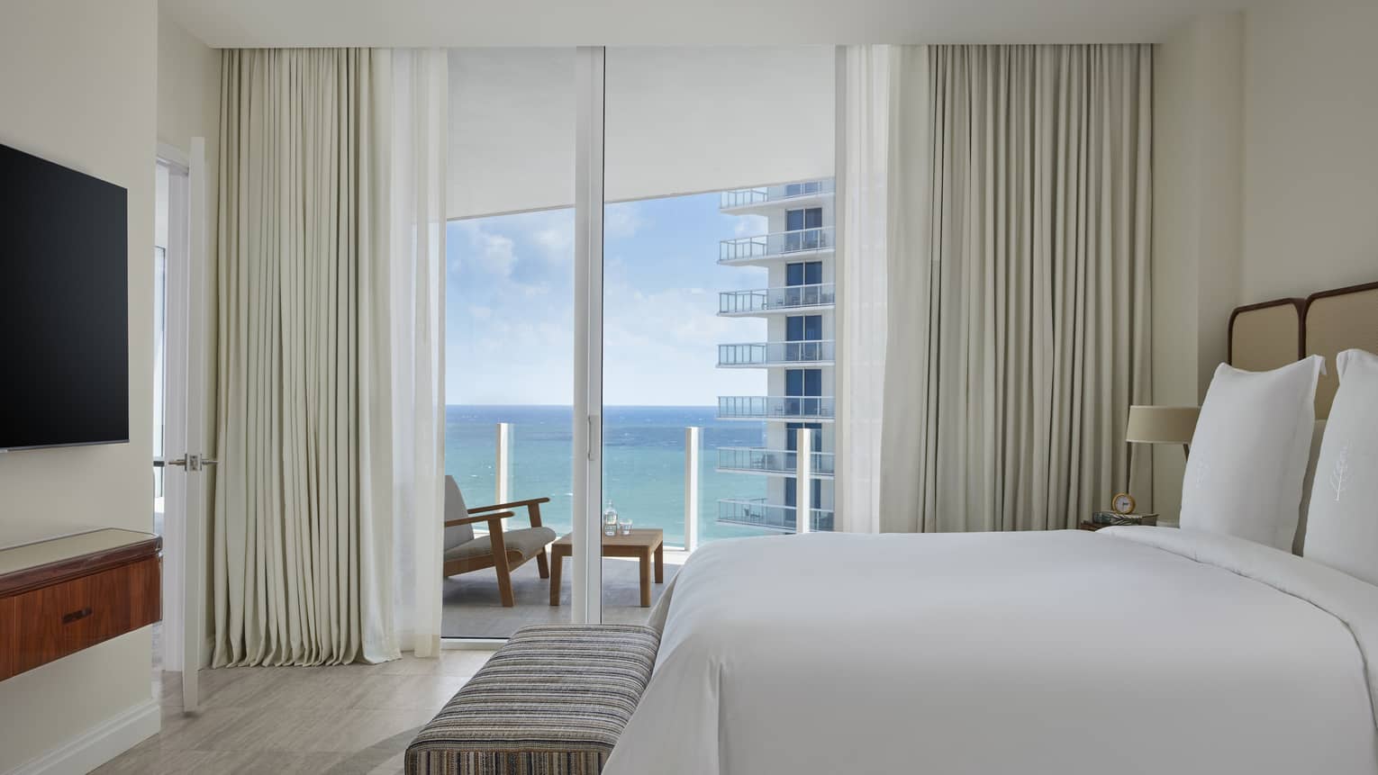 Bedroom with walk-out, ocean-view balcony