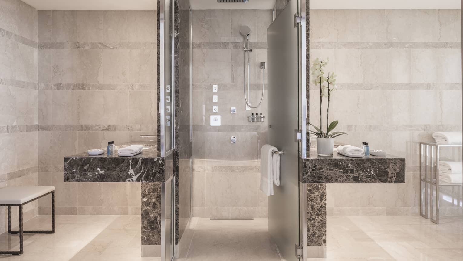 Presidential Suite bathroom, walk-in shower flanked by black marble vanities