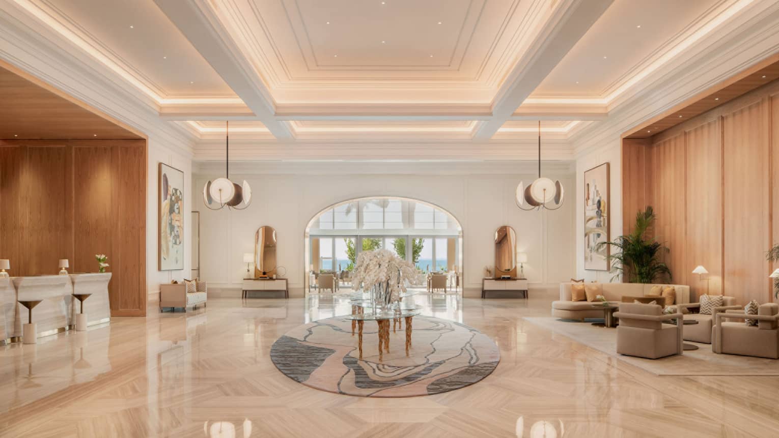 Elegant lobby with marble floors and large floral centrepiece