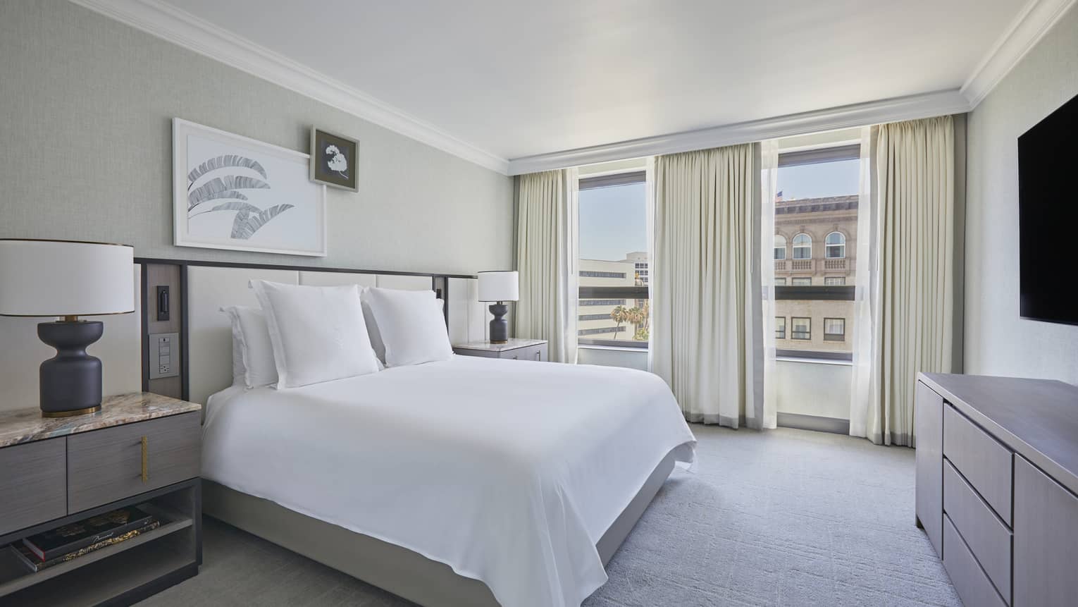 Bedroom with king bed and two windows