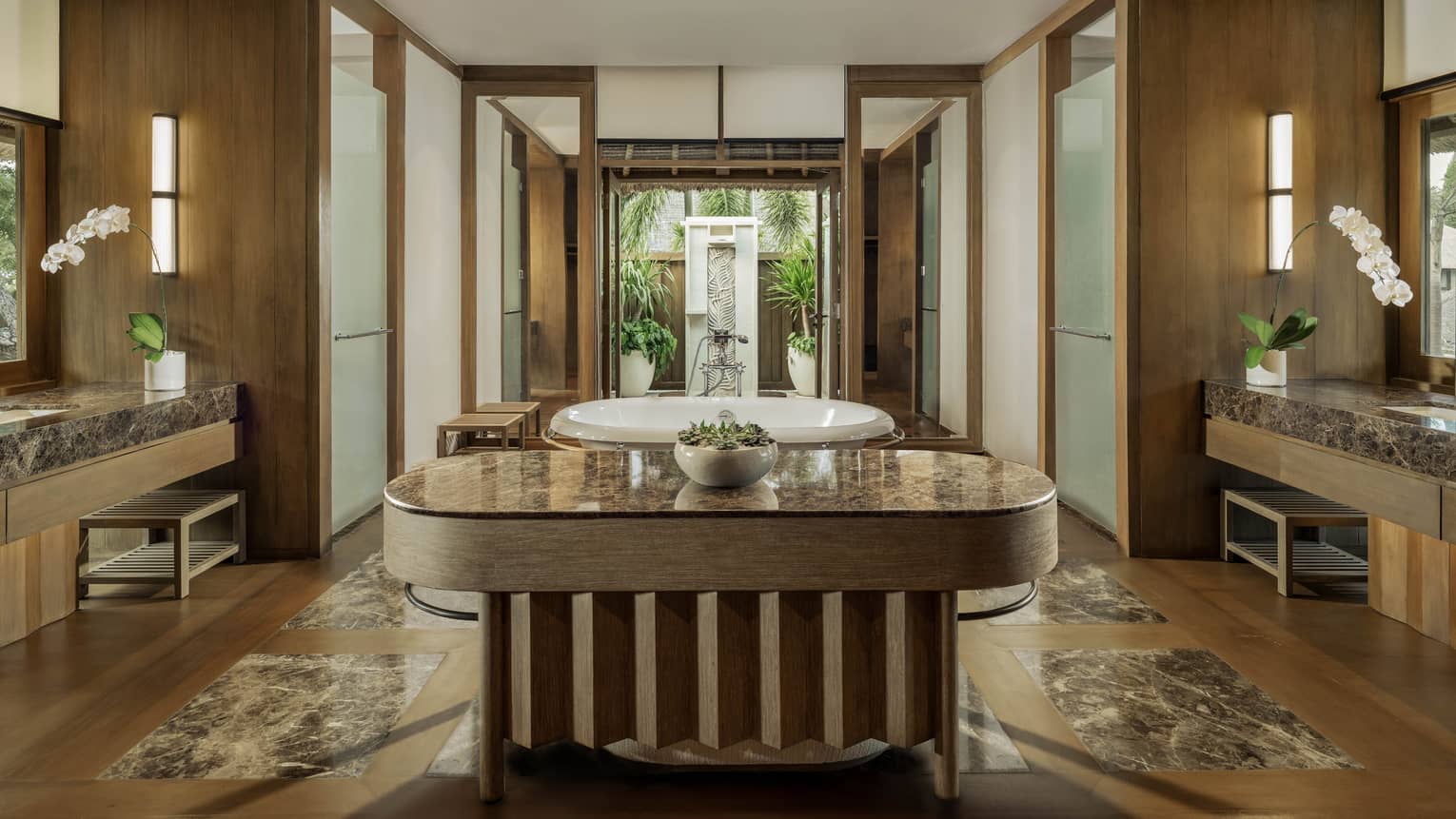 Expansive luxury bathroom with standalone tub and outdoor shower in private residence at at Four Seasons Resort Bali at Jimbaran Bay