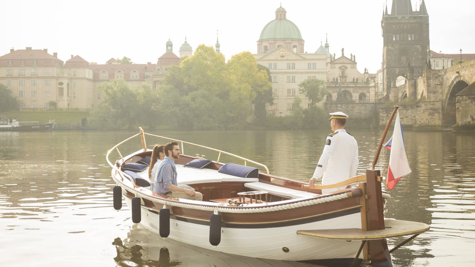 Couple enjoying river boat trip in Prague