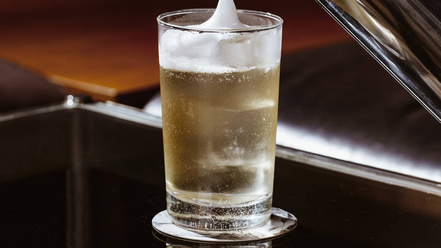 Foam being poured into a drink.