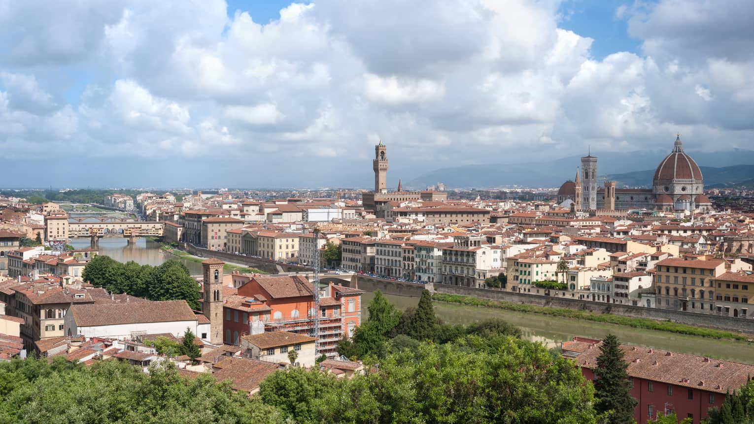 Daytime view over Florence rooftops, houses, cathedrals