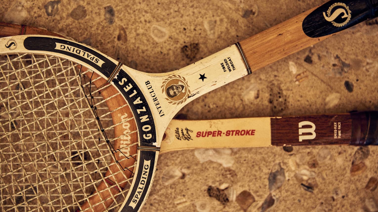 Two tennis racks made of wood.