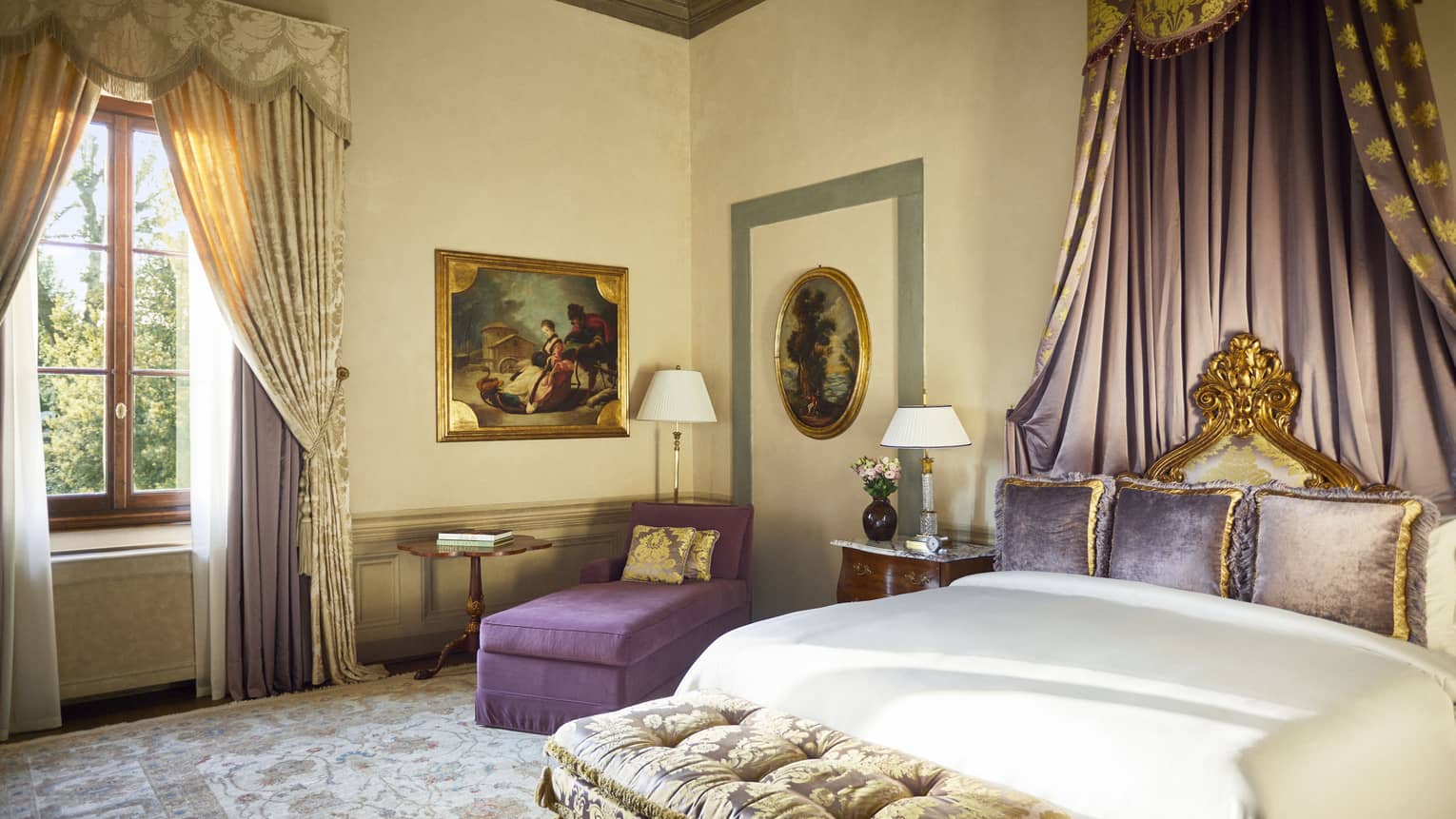 Royal Suite bedroom with king bed, draped canopy detail, plum-coloured chaise and gold window drapes, at Four Seasons Hotel Florence, Italy