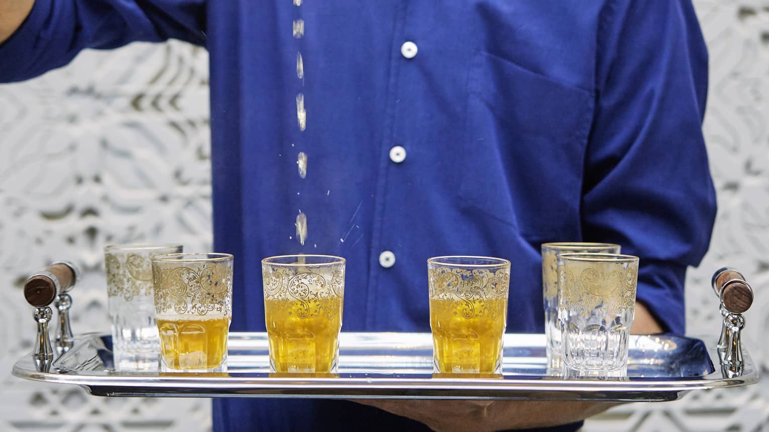 Decorative Moroccan tea glasses on tray