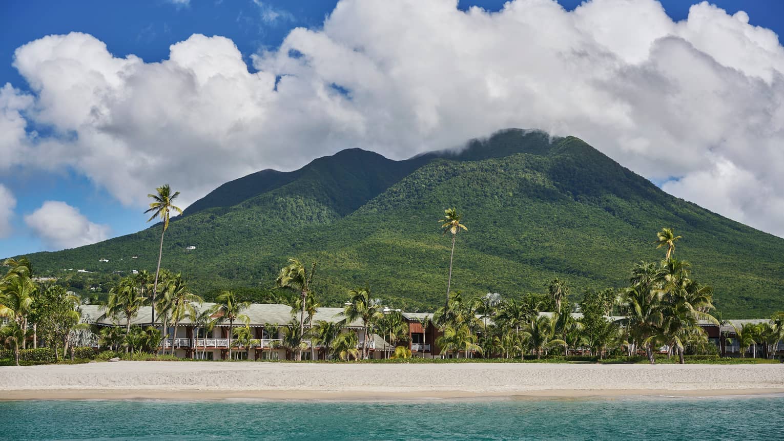 Four Seasons Resort Nevis, white sand beach and green mountain