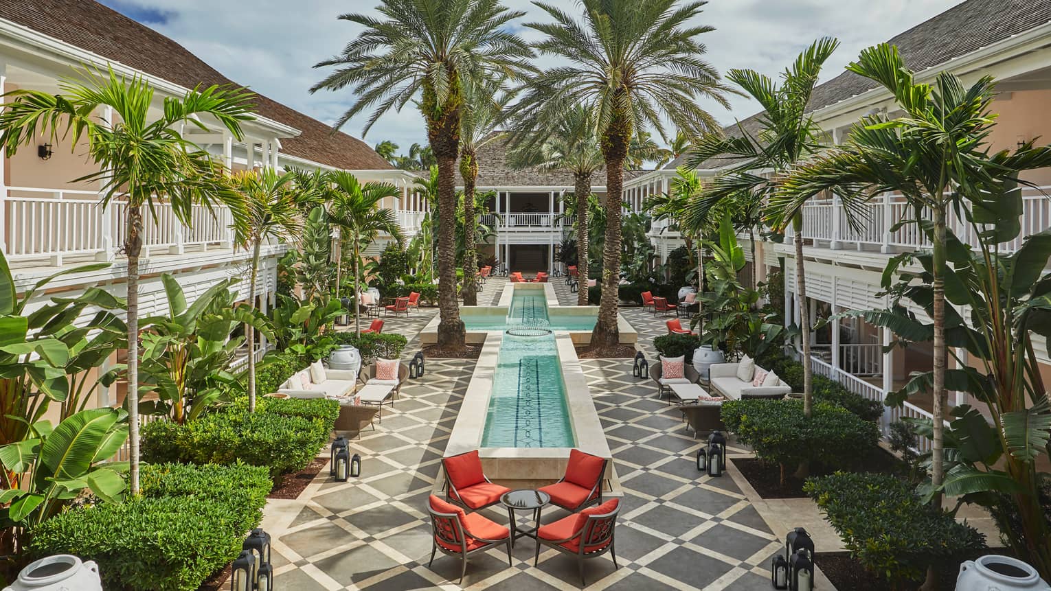 Bahamas Luxury Resort The Ocean Club A Four Seasons Patio Chairs Tables Around Cross Shaped Fountain Large Palm Trees In Hartford Courtyard
