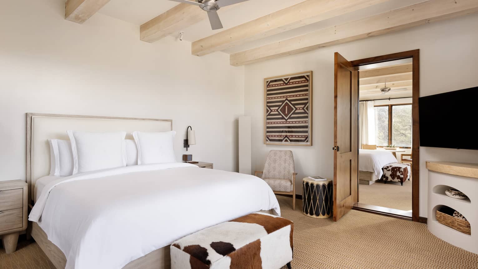 Guest room with king bed, connecting to another guest room at Four Seasons Resort Santa Fe