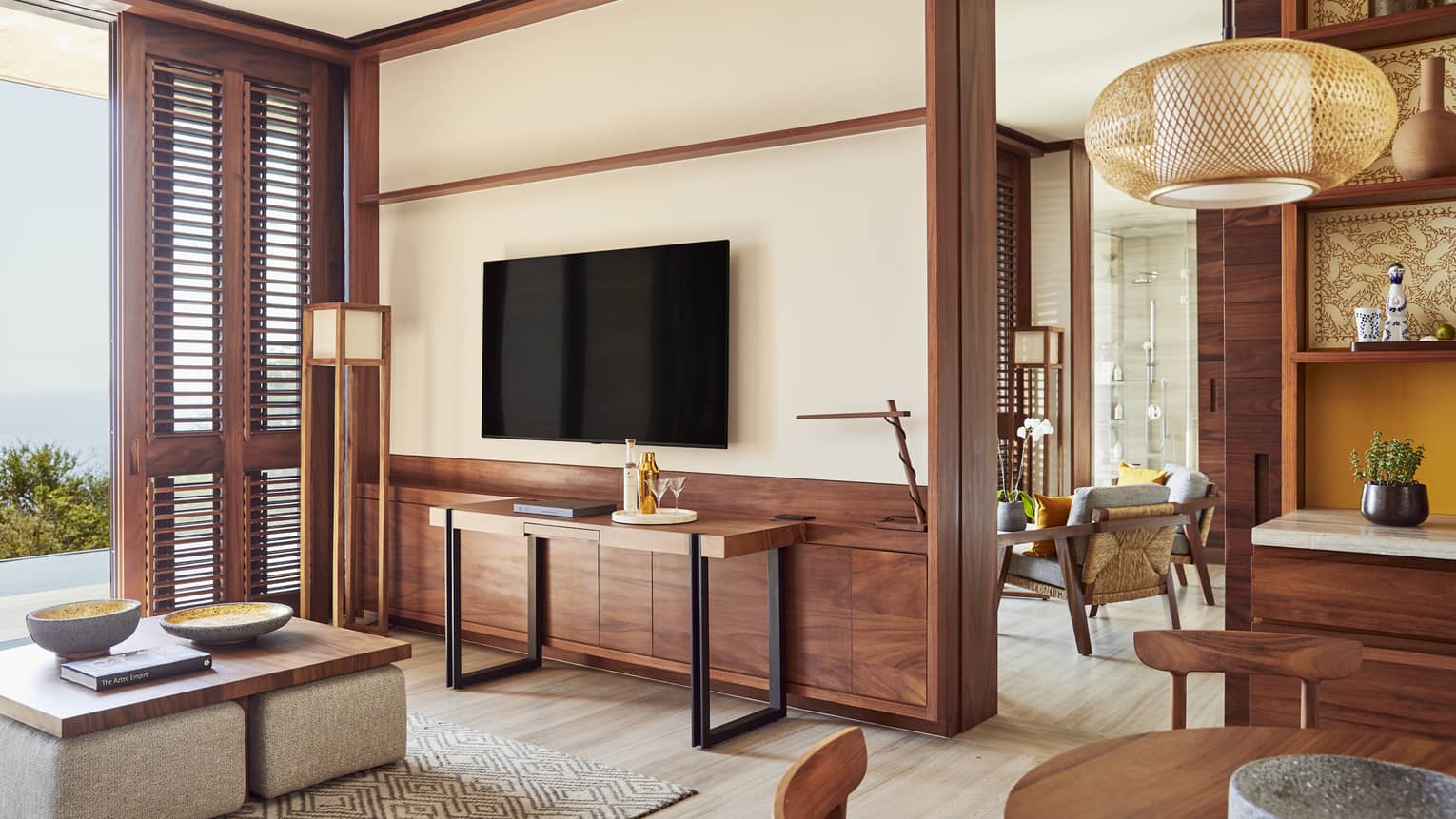 Hotel suite living room, dining area and walk-out private pool terrace