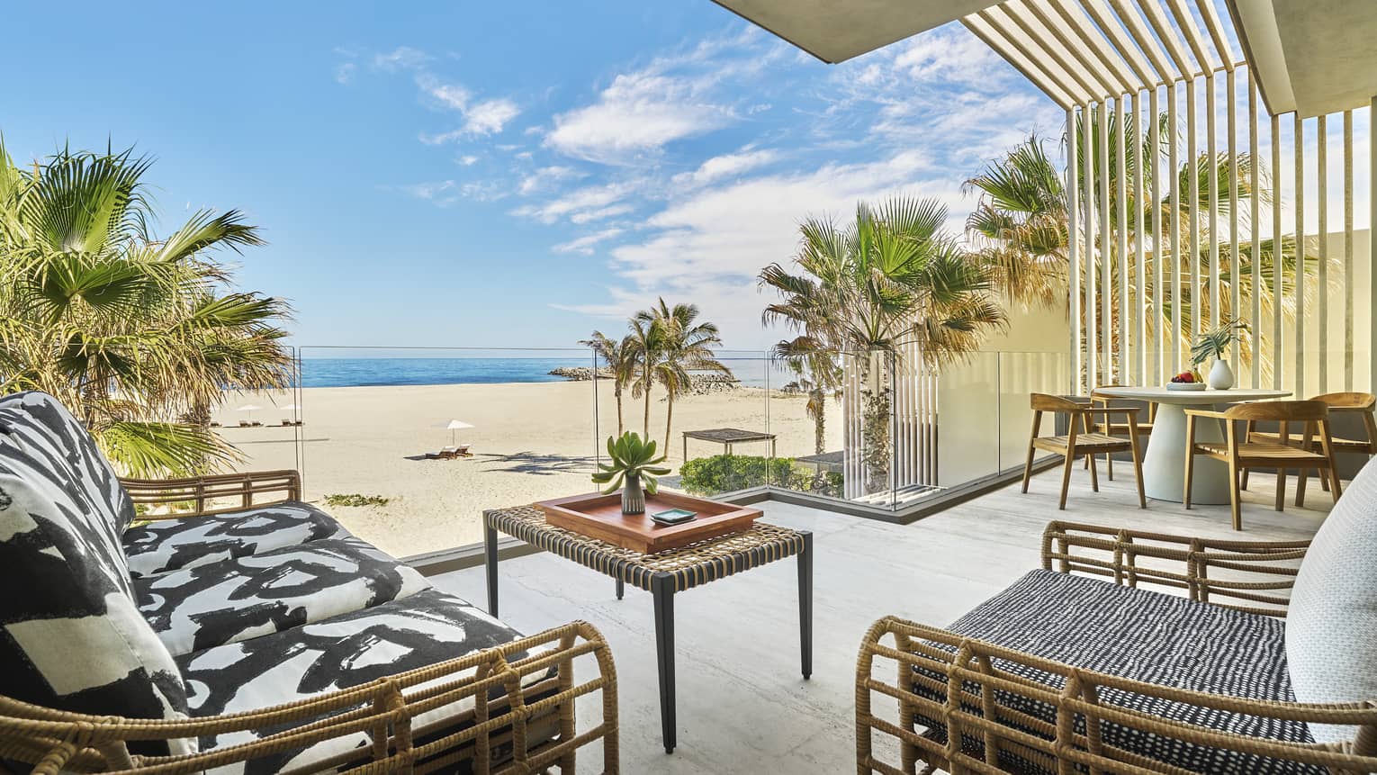 Terrace with chic lounge furniture, oceanfront suite at Four Seasons Resort Los Cabos