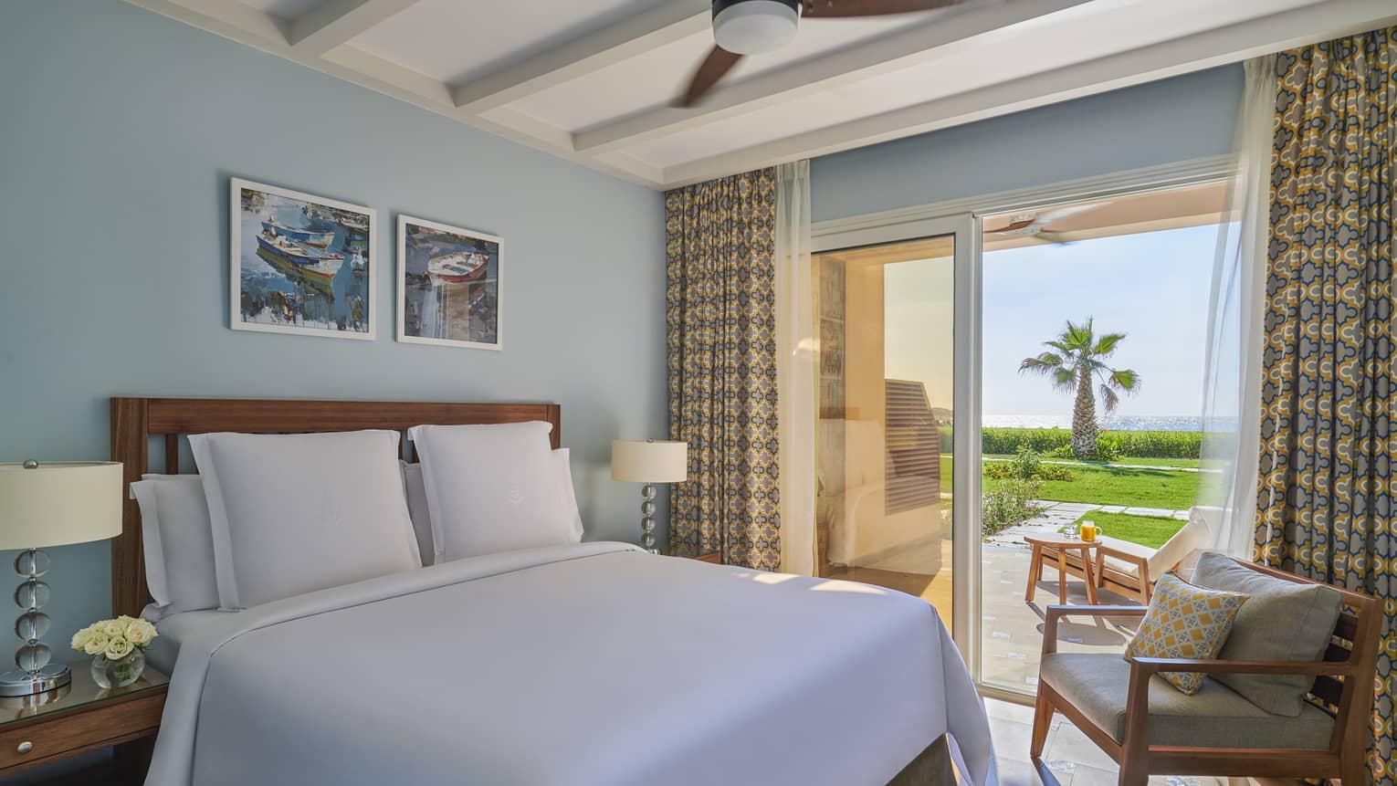 A freshly-made bed in the beach suite overlooking the marsh