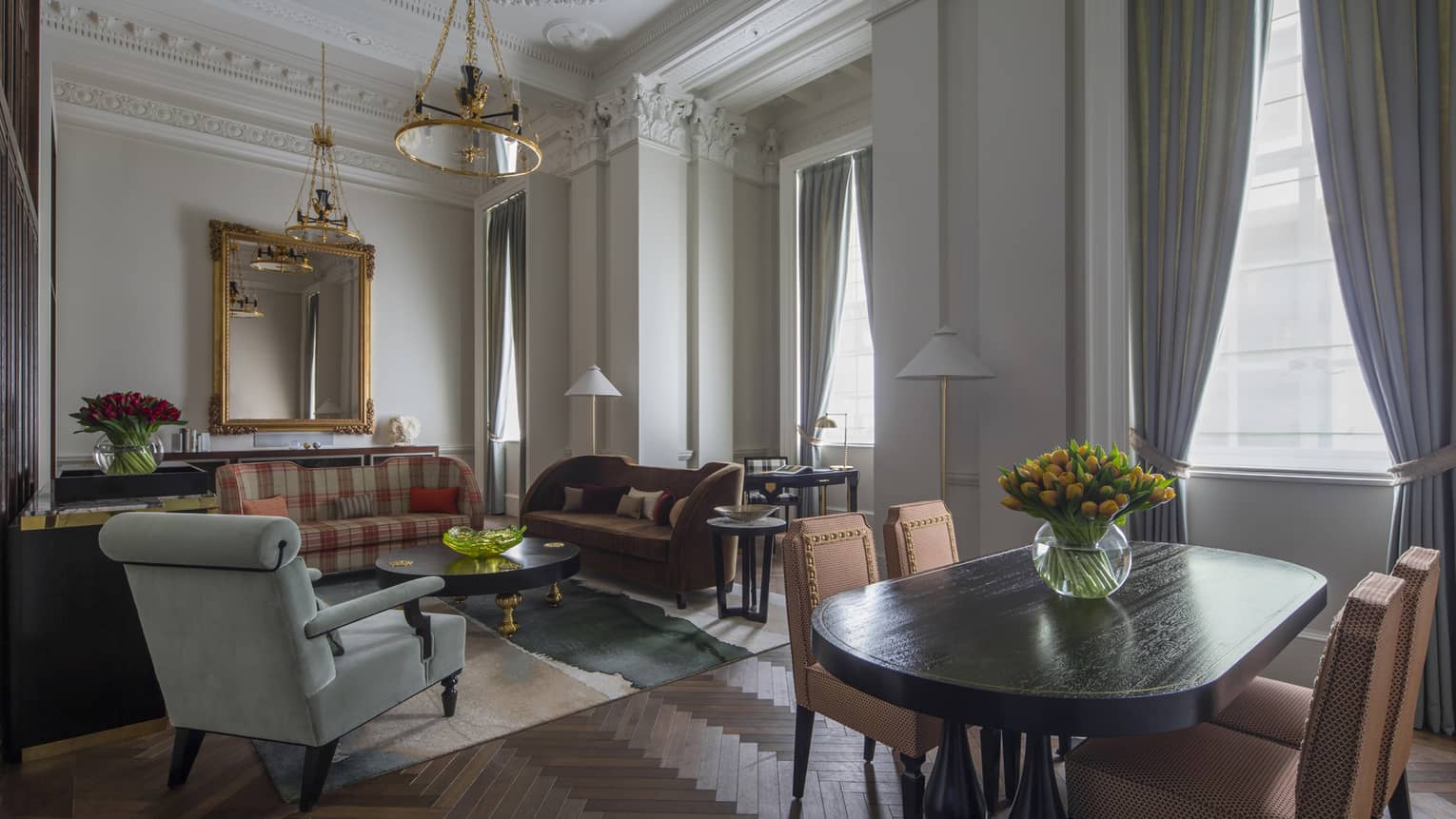 Heritage Suite dining table, seating area by tall, sunny windows 