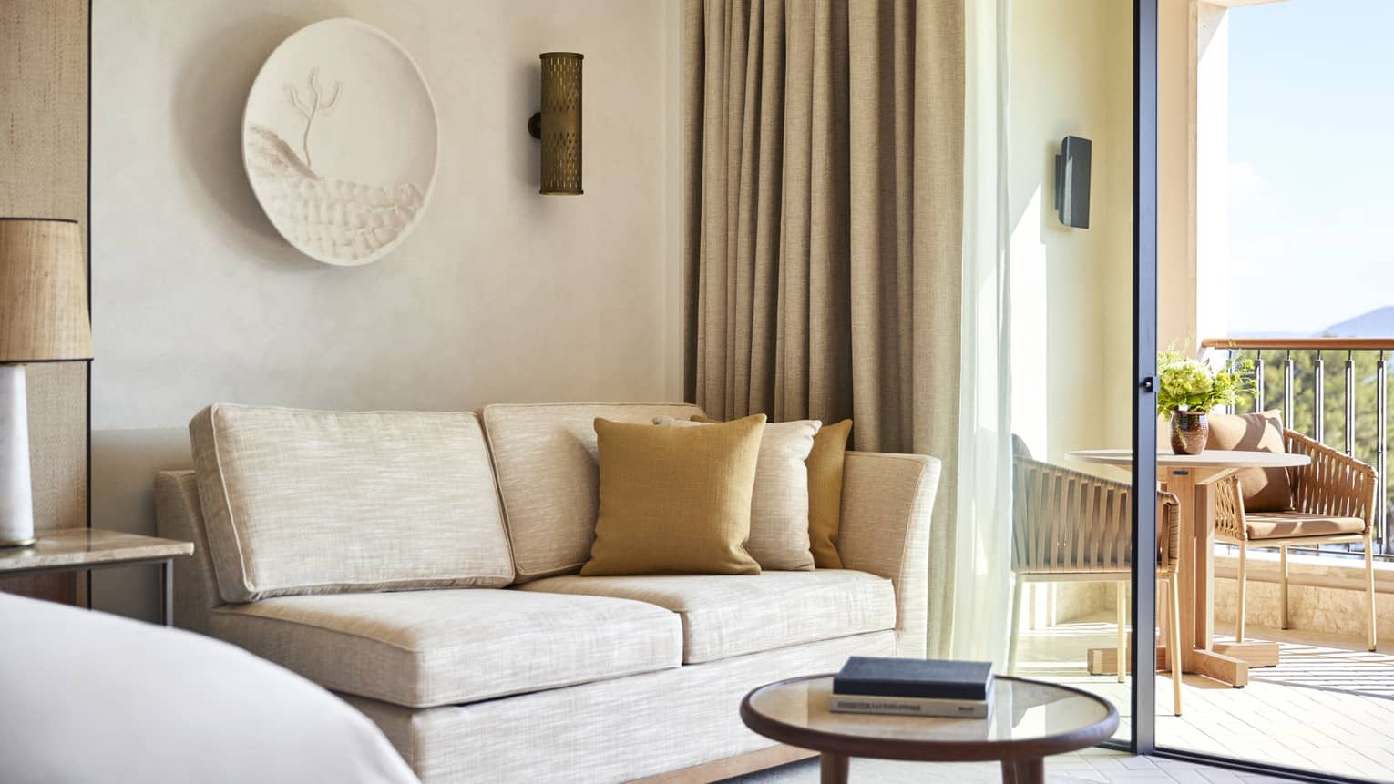 Sitting area of luxury hotel suite with sea view at Four Seasons Resort Mallorca