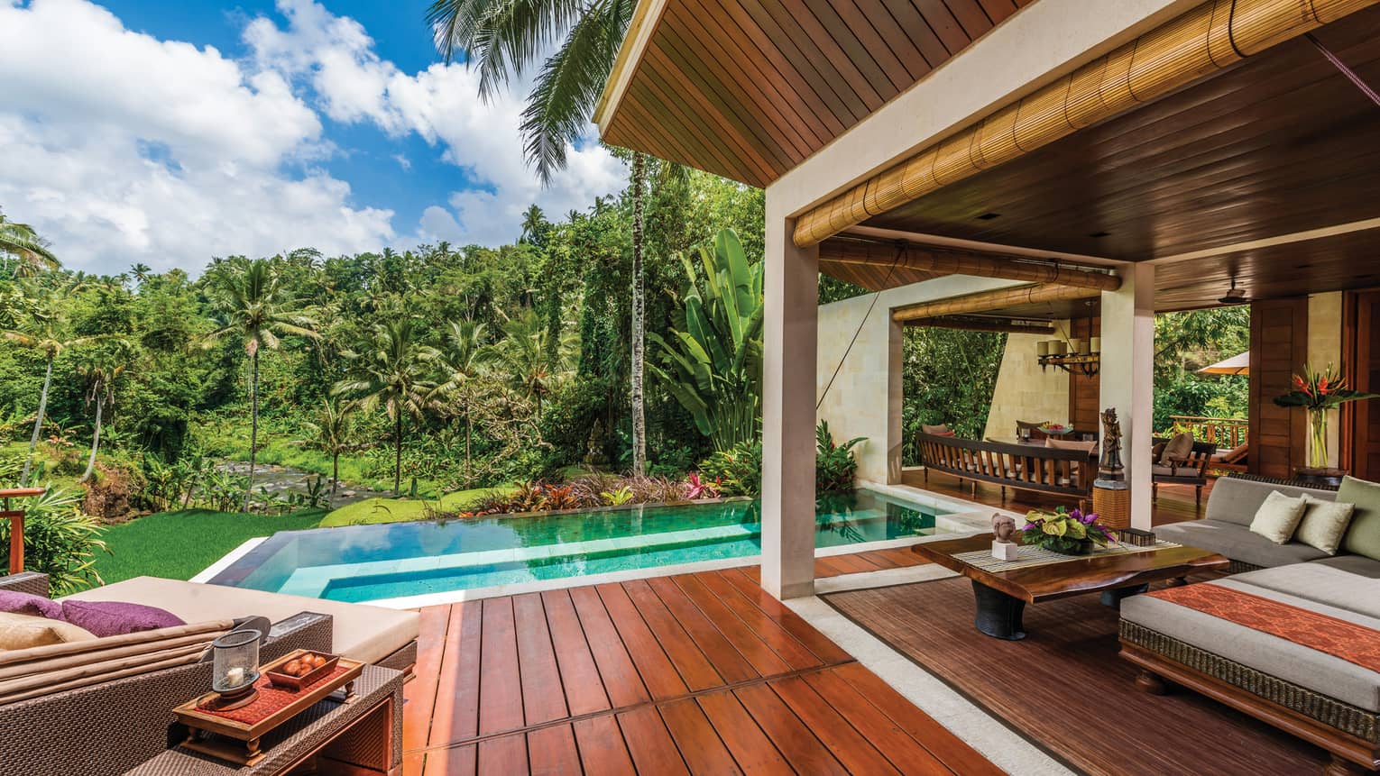 River-View Two Bedroom Villa patio with wood deck, blue plunge pool, large patio sofas with cushions, forest views