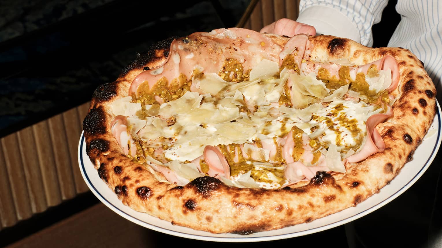 Large pizza topped with mortadella and mozzarella