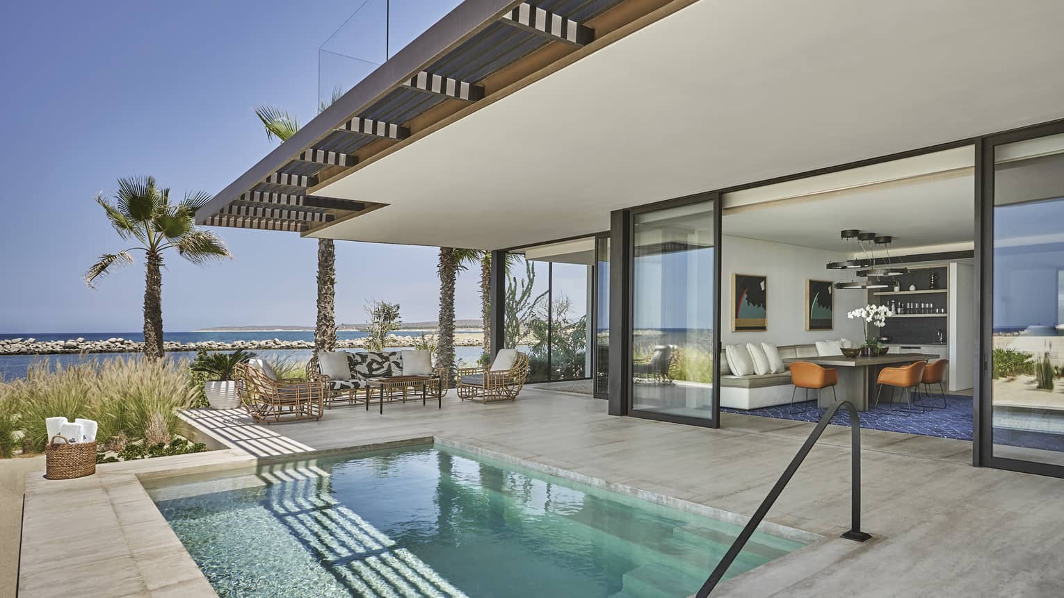 Private terrace with plunge pool and large sliding doors to suite