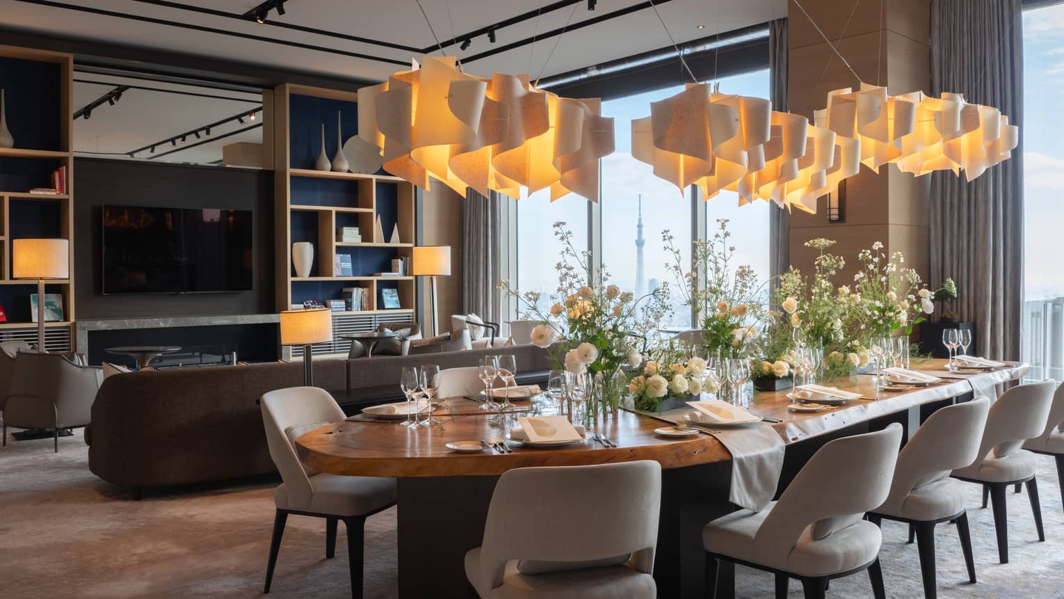 Private dining room featuring contemporary lighting fixture and table for 10 guests