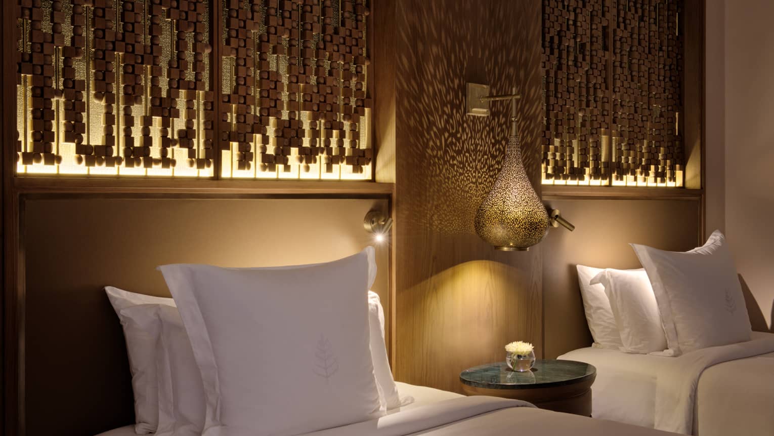 Hotel room with two beds and illuminated headboards