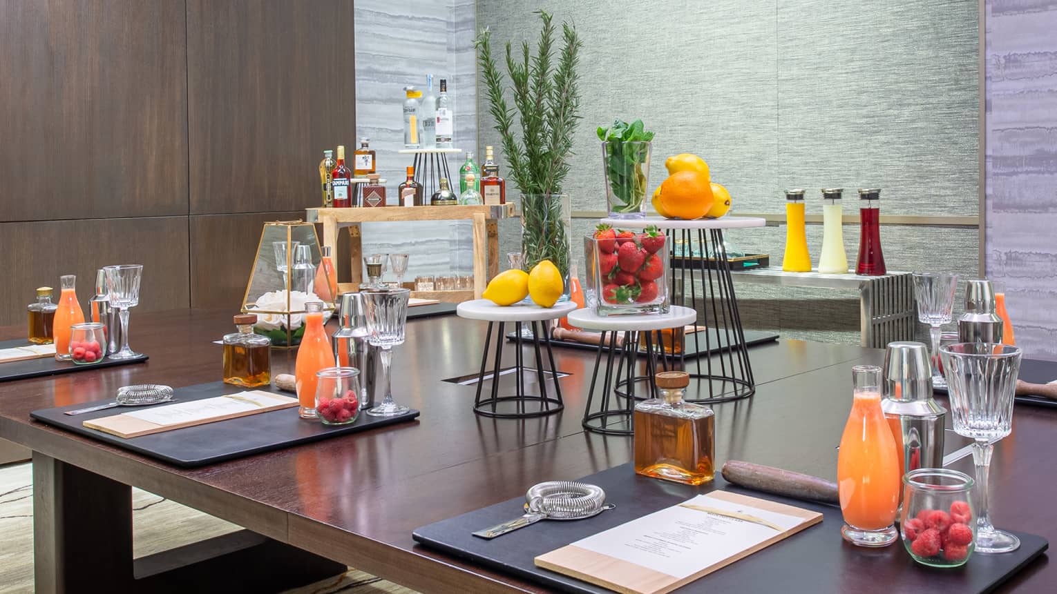 A table with fresh juice and fruits.