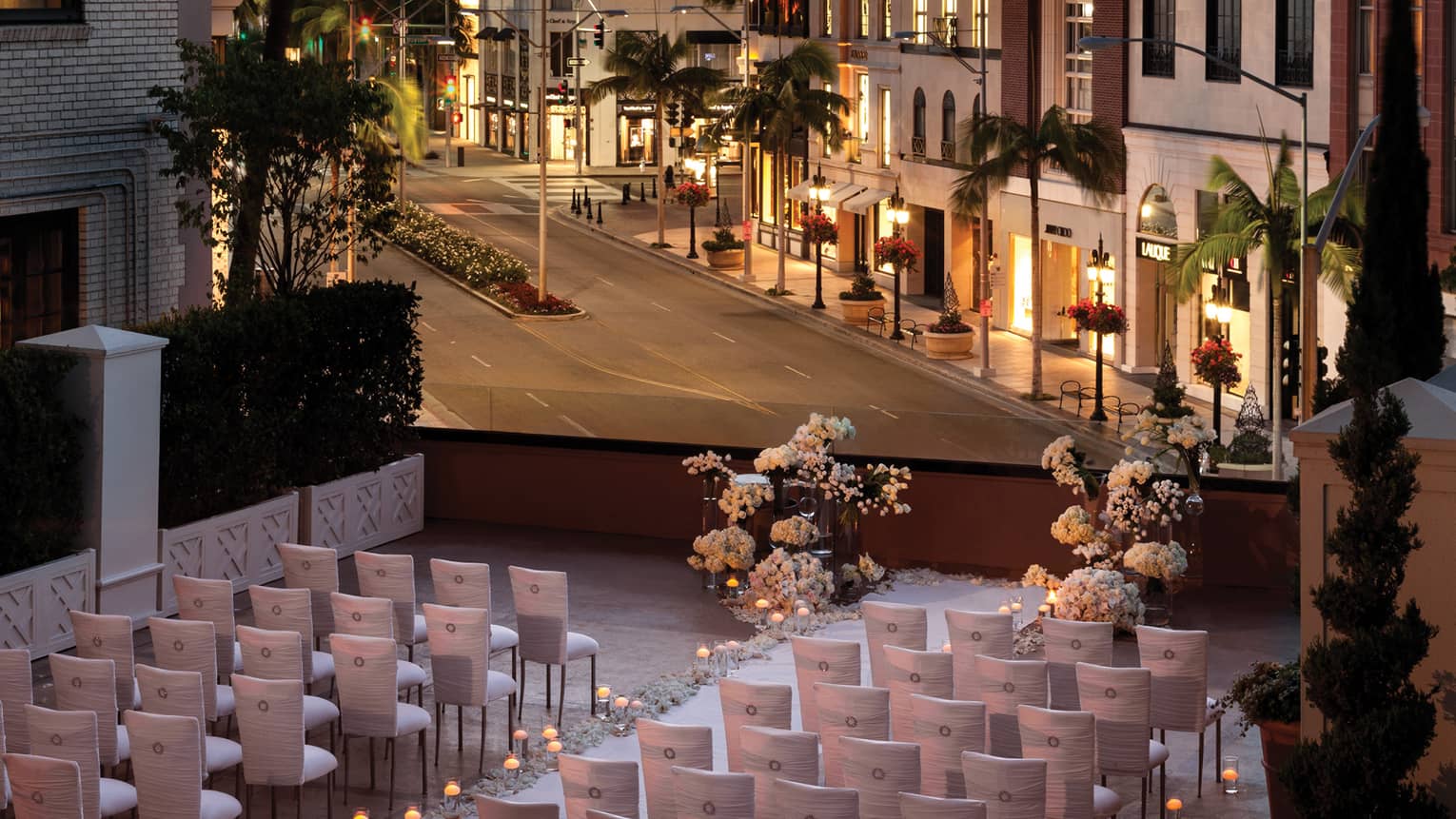 Wedding set up on terrace above Beverly Hills street view at sunset 