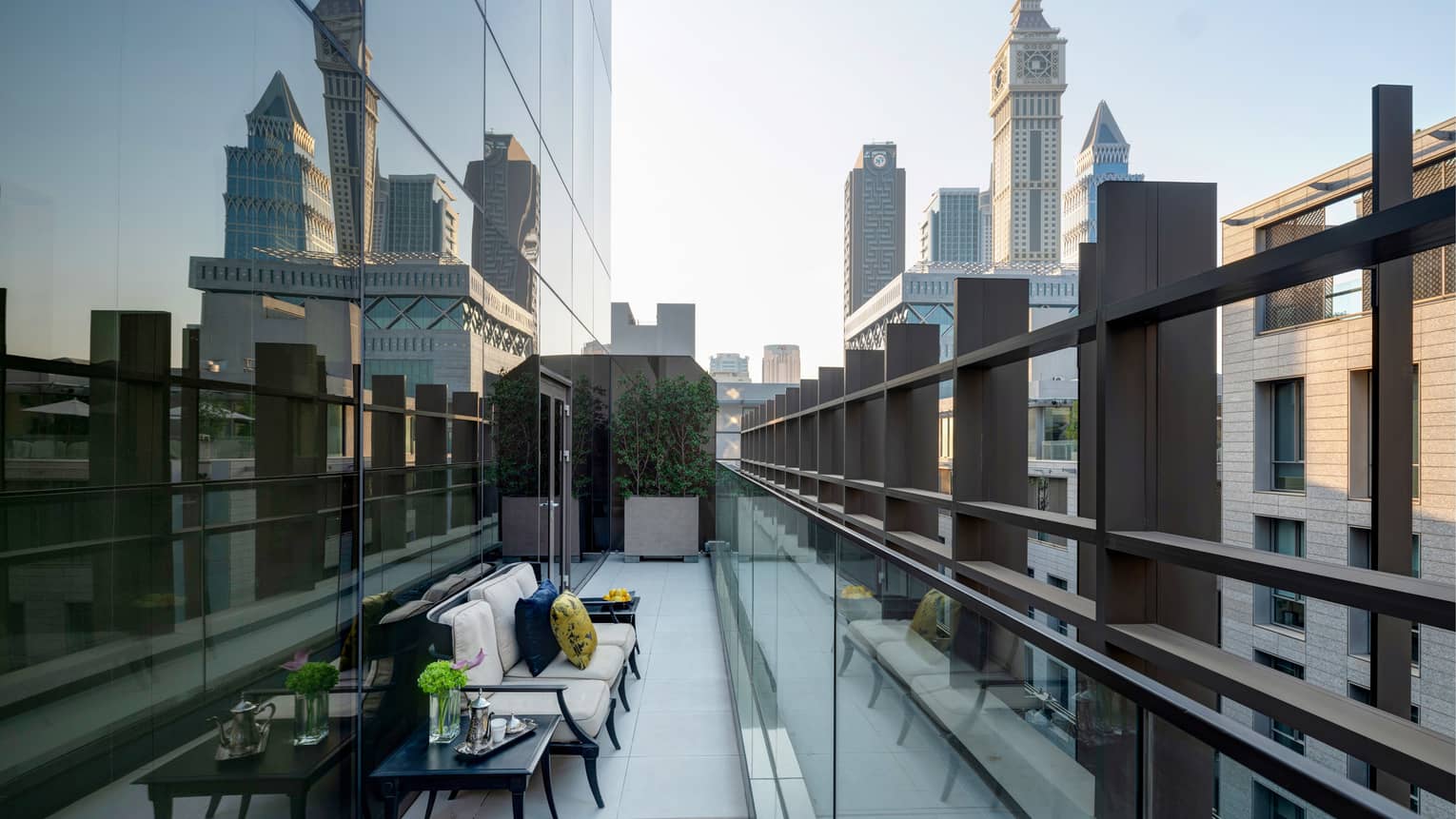 Outdoor terrace in city setting, against mirrored building