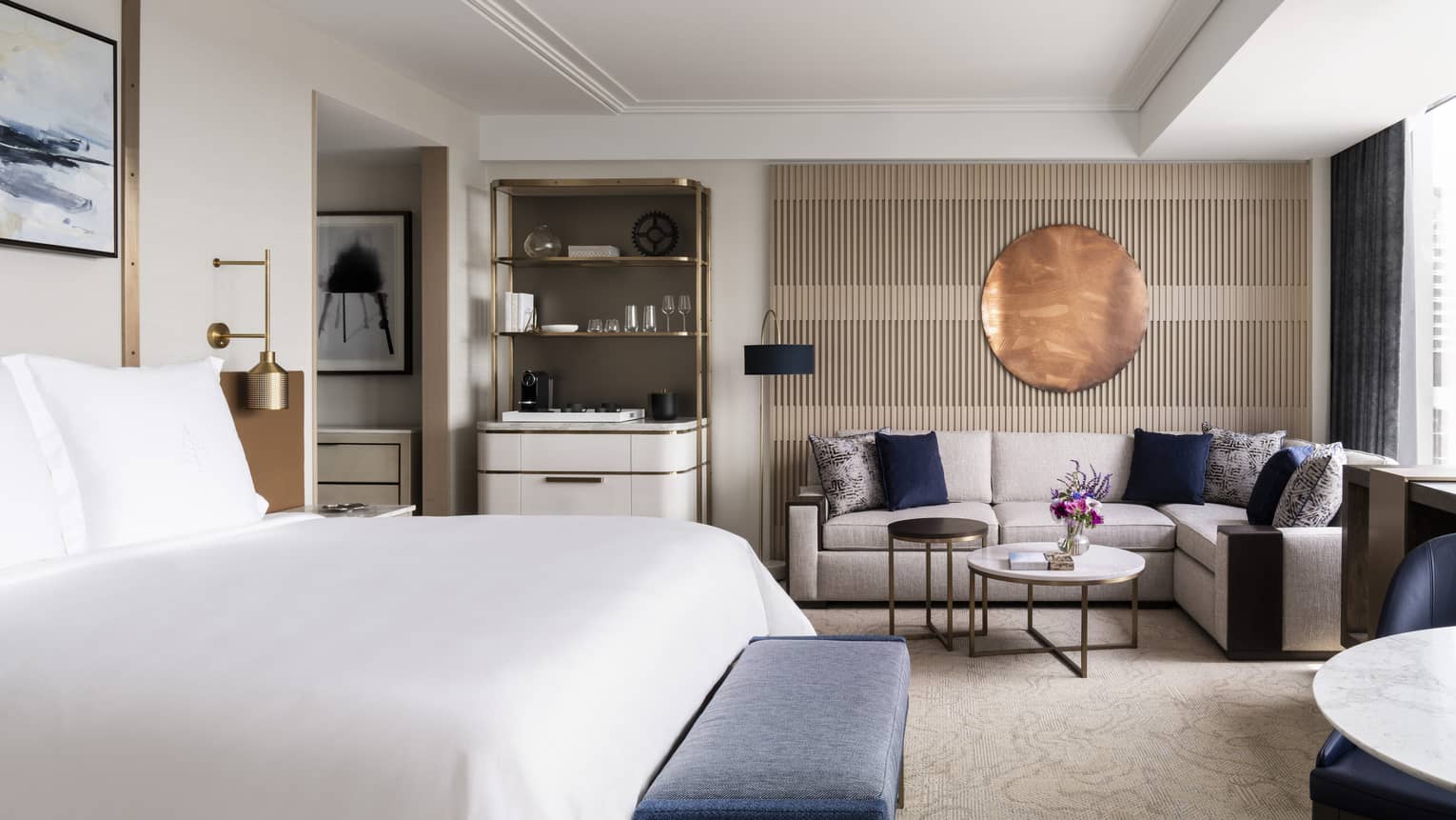 Hotel room with king bed and l-shaped sofa