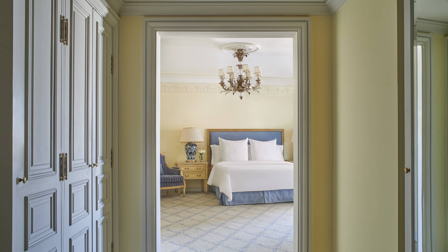 Deluxe Two Bedroom Suite hallway with bed visible