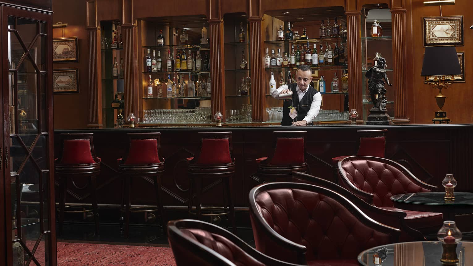 Bartender mixes drink at Le Bar