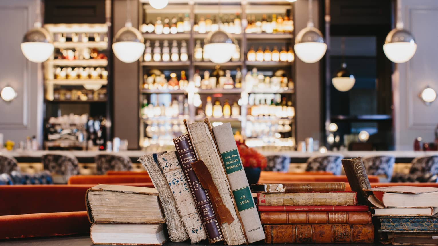 Antique books on a shelf in Bar Margot 