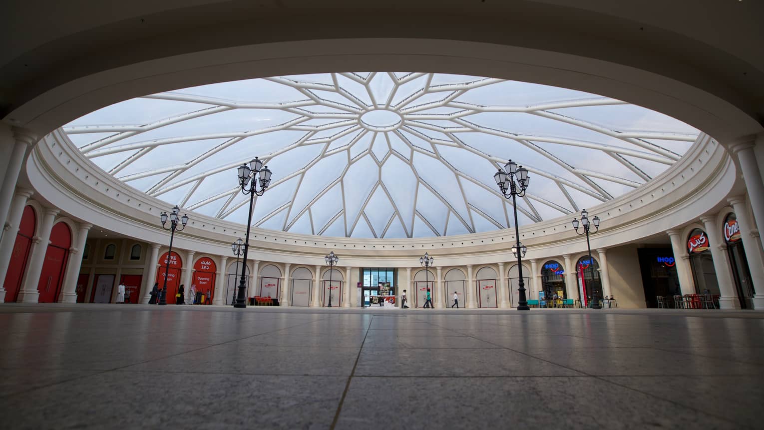 The Avenues shopping centre with streetlamps under large domed ceiling