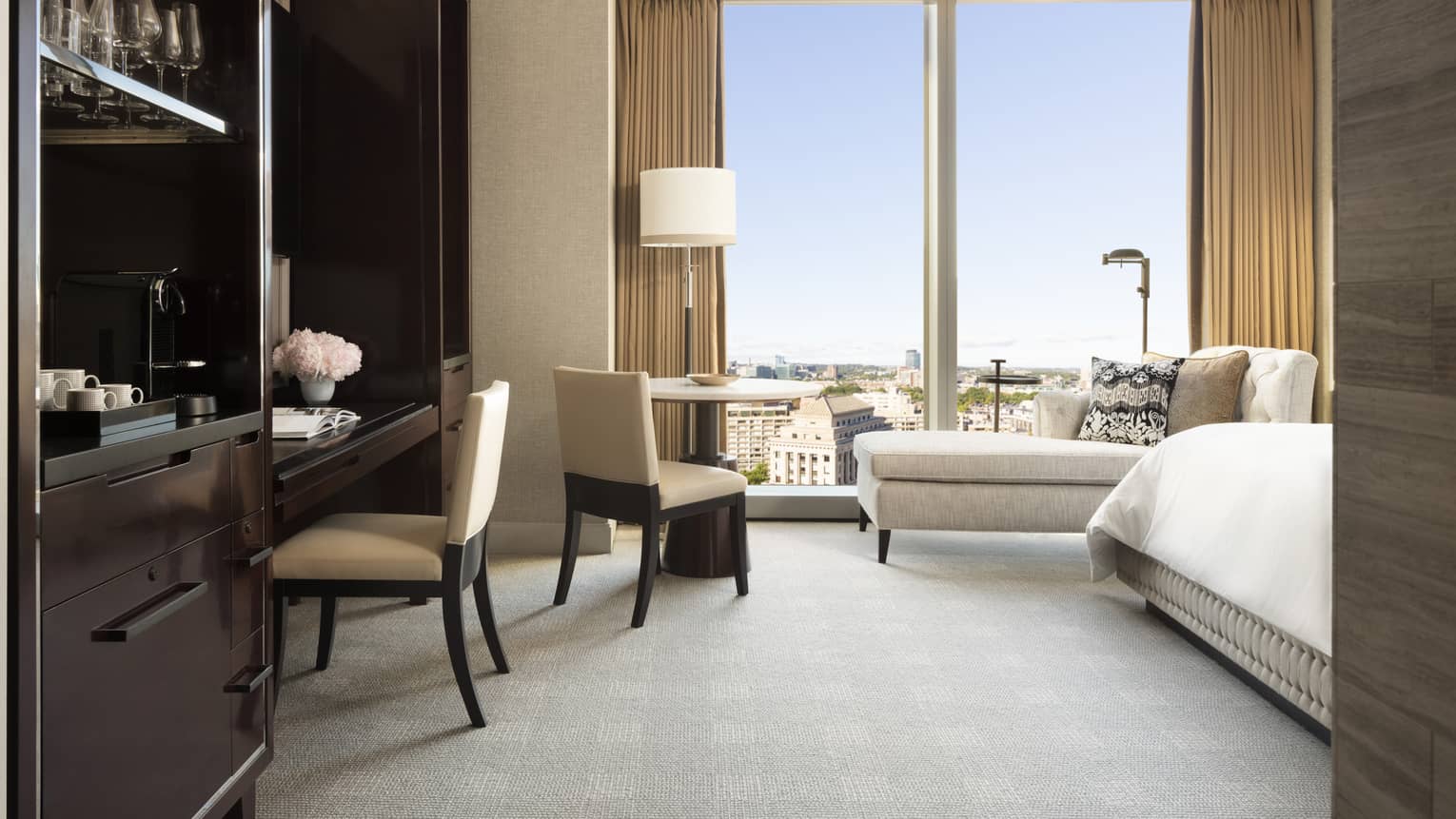 Natural light pours into a guest room at four seasons hotel boston one dalton