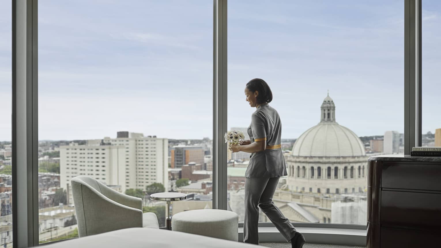 Housekeeping delivers a floral arrangement to the corner suite at four seasons hotel boston one dalton