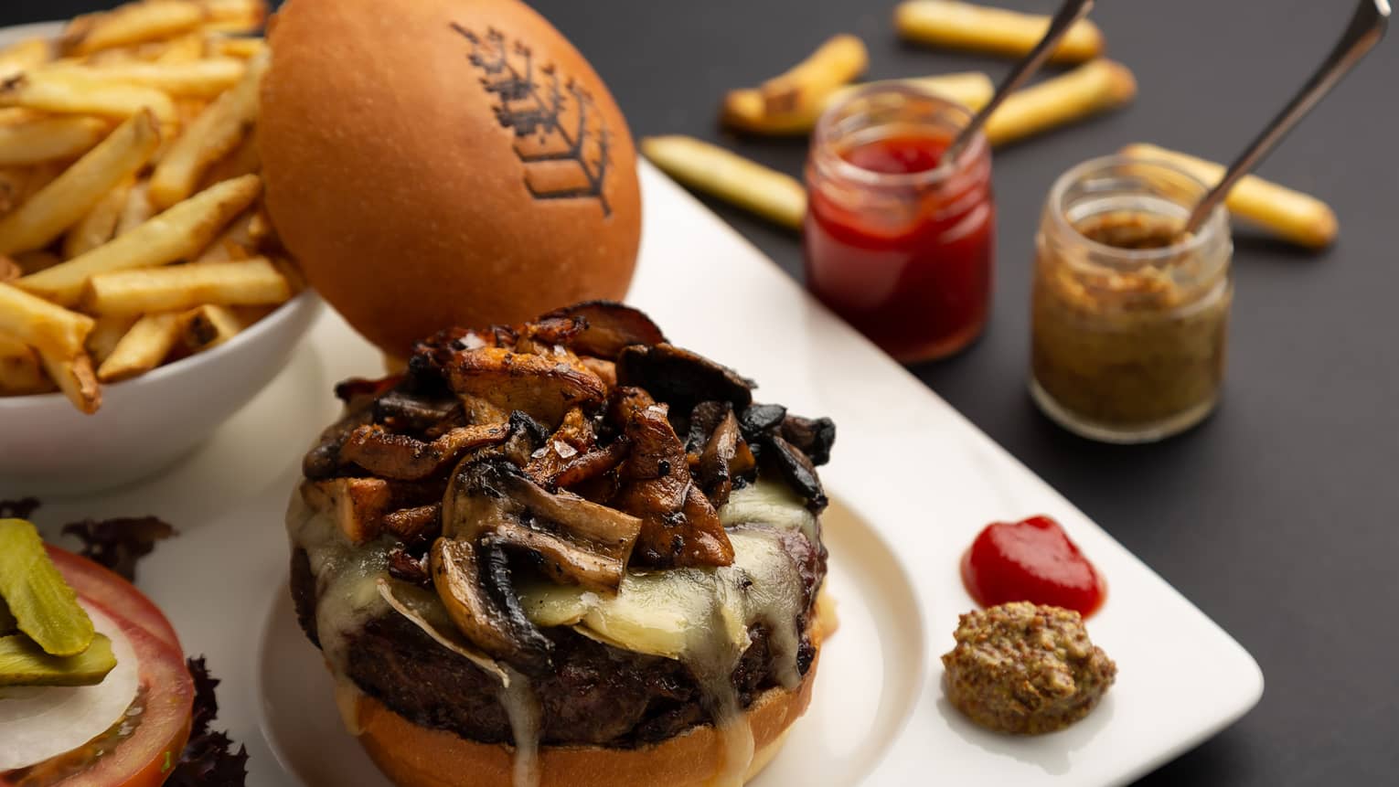 Ranger’s valley Australian beef burger, sautéed mushrooms, comté or brie cheese with side of French fries and condiments