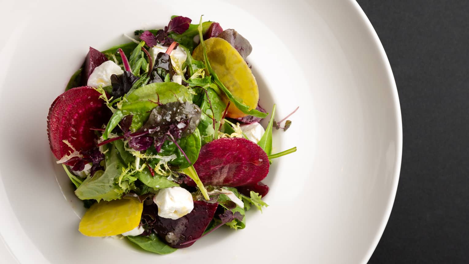 Red and gold beet salad with feta cheese, orange and pistachio