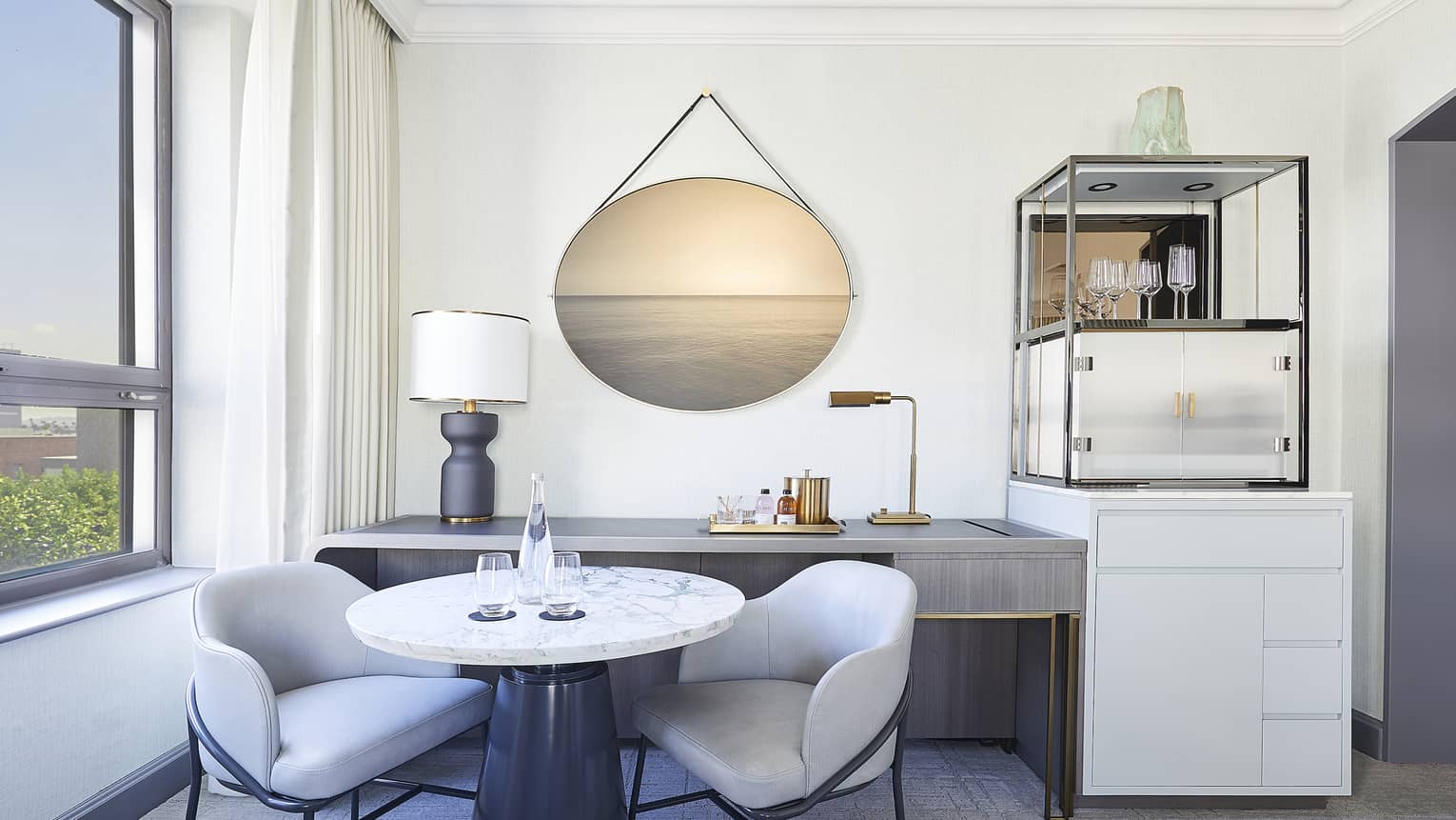 Round marble table with two chairs