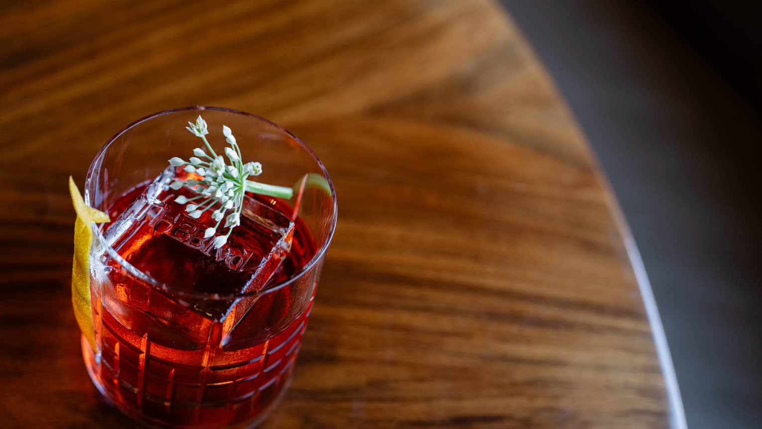 Negroni with herb garnish