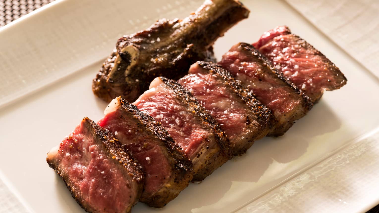  Japanese Pure Wagyu Beef slices of sirloin steak on white platter
