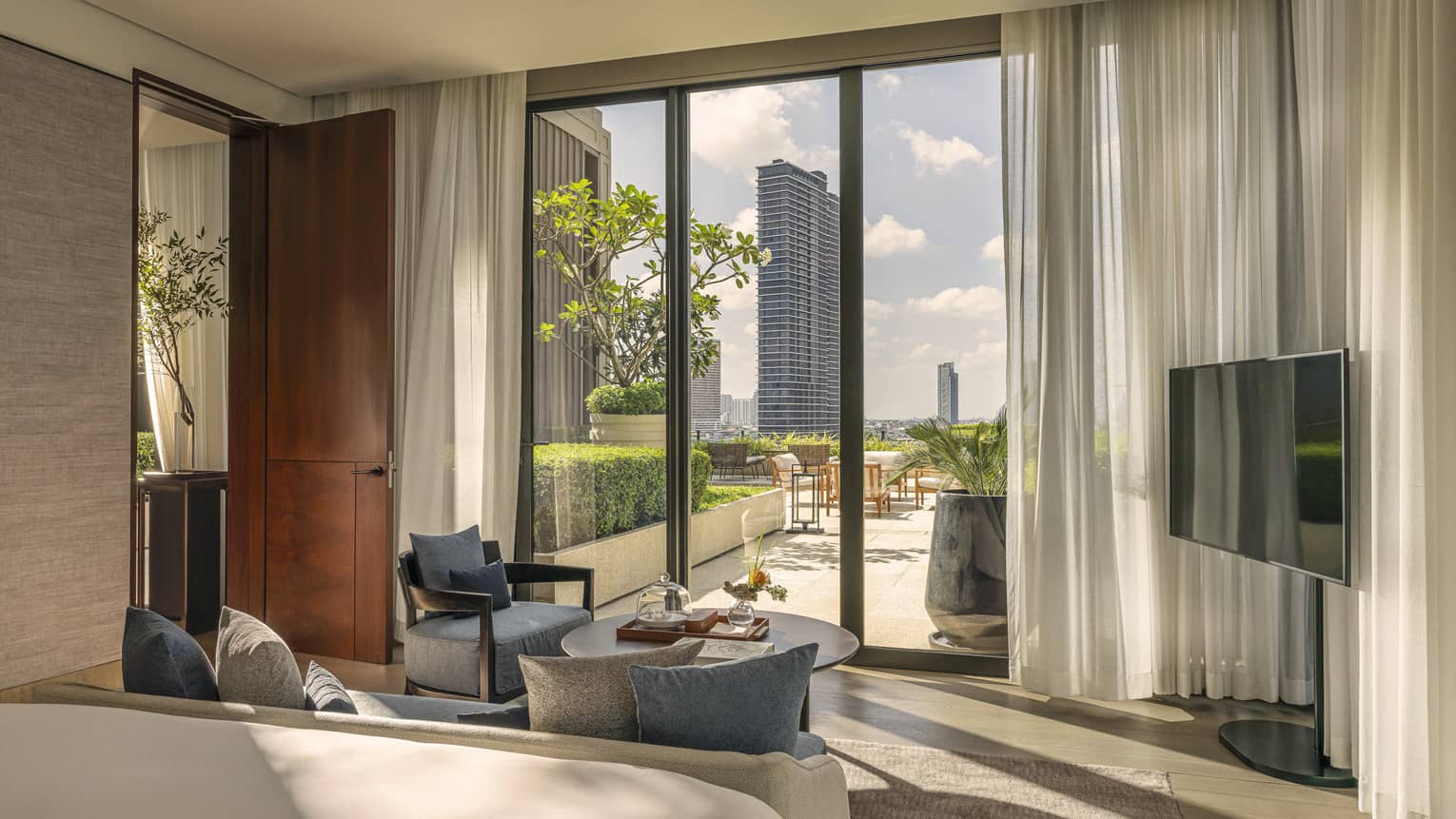 Four Seasons Hotel Bangkok two-bedroom suite sitting area with walk-out terrace