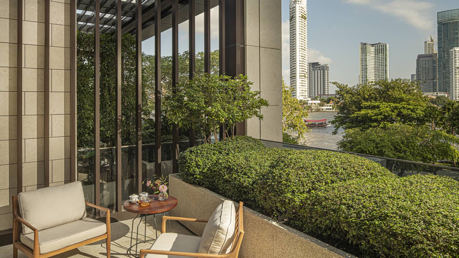 River-view balcony of guest room at Four Seasons Hotel Bangkok